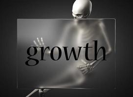 palabra de crecimiento en vidrio y esqueleto foto