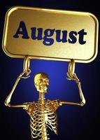 August word and golden skeleton photo