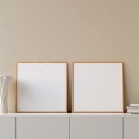Modern and minimalist square wooden poster or photo frame mockup on the table in the living room. 3d rendering.