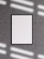 Modern and minimalist vertical black poster or photo frame mockup on the concrete wall in a room. 3d rendering.