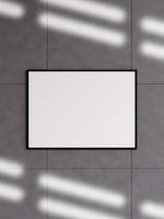 Modern and minimalist horizontal black poster or photo frame mockup on the concrete wall in a room. 3d rendering.