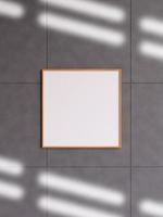 Modern and minimalist square wooden poster or photo frame mockup on the concrete wall in a room. 3d rendering.