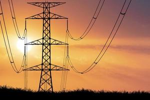 silhouette of the structure of high voltage transmission towers rural electric power distribution concept photo