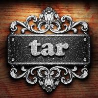 tar word of iron on wooden background photo