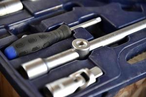 A set of iron keys with a head in a case photo
