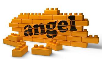 angel word on yellow brick wall photo