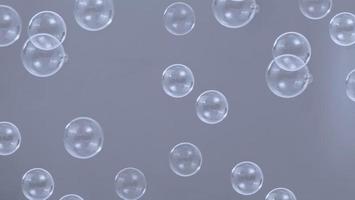 gota de pompas de jabón o burbujas de champú flotando como volando en el aire foto