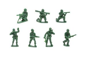 miniature toy soldiers with guns on white background photo