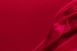 Red silk or satin luxury fabric texture can use as abstract background photo