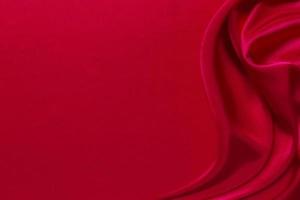 Red silk or satin luxury fabric texture can use as abstract background photo