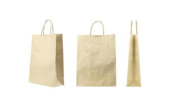 Brown folded paper bag with handles isolated on white background photo