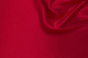 Red silk or satin luxury fabric texture can use as abstract background photo