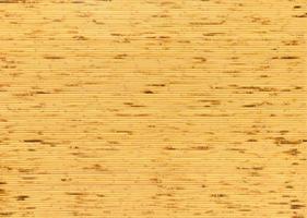 background and texture of decorative yellow bamboo wood on finishing wall surface. bamboo line making from fire burn. photo