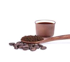 Coffee beans with ground coffee isolated on white background photo