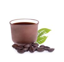Black coffee with coffee beans isolated on white background photo