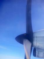 Twin Propeller Plane Twin Turboprop flying in the sky photo