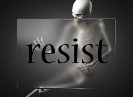 resist word on glass and skeleton photo