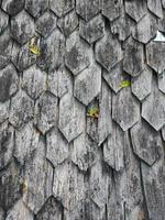 Old style wooden handmade shingle roof grey color photo