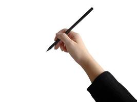 mano femenina aislada que sostiene la escritura a lápiz negro, para el elemento de presentación foto