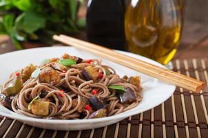 Soba noodles with eggplant in sweet and sour sauce photo