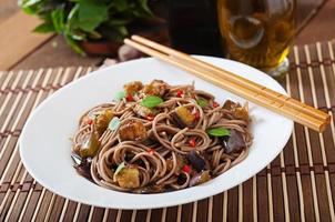 Soba noodles with eggplant in sweet and sour sauce photo