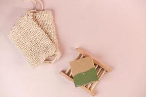 herbal soap and soap bag on color background photo