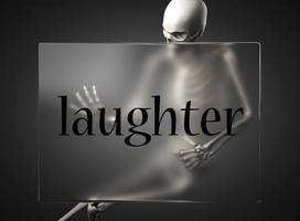 laughter word on glass and skeleton photo