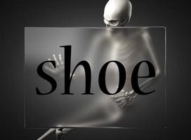 shoe word on glass and skeleton photo