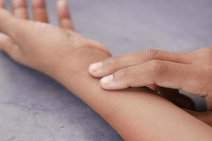 measuring pulse on wrist of hand photo