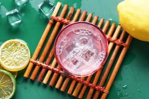 Refreshing lemon water drink on table , top view photo