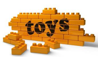 toys word on yellow brick wall photo