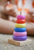 child playing with a Baby toys on bed, Child development concept. photo