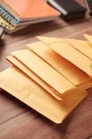 yellow paper bubble envelope on table photo