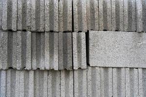 Concrete block wall texture. Grunge seamless wall background. Stacks of concrete blocks photo