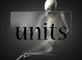 units word on glass and skeleton photo