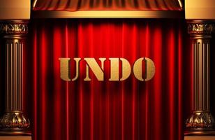undo golden word on red curtain