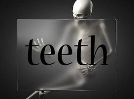 palabra de dientes en vidrio y esqueleto foto