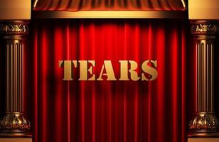 tears golden word on red curtain photo