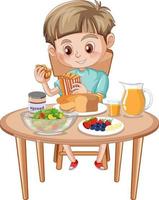 A boy having meal at the table vector