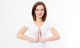 Beautiful girl in namaste pose on white background isolated. Young woman doing sport exercises isolated. photo