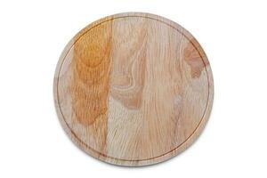 Round wood beech cutting board isolated on white. Wooden plate for meat and vegetable on white background. photo