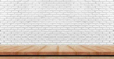 Empty wooden table top, counter or shelf on white brick wall background, For food display banner, backdrop. photo