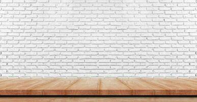 Empty wooden table top, counter or shelf on white brick wall background, For food display banner, backdrop. photo