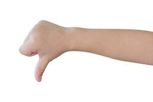 child hand shows thumb down isolated on white background, with clipping path. photo