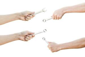 Set of hand holding a spanner isolated on a white background with clipping path. photo
