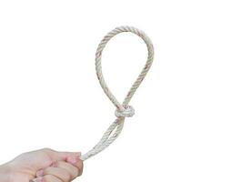 Man's hand holding rope isolated on a white background. with clipping path. photo