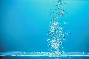 Abstract background image of bubbles in blue water. photo