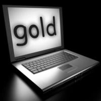 gold word on laptop photo