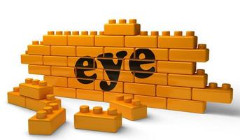 eye word on yellow brick wall photo