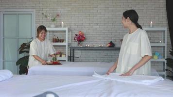 young asian female staff prepare spa facilities and equipment, spa element video